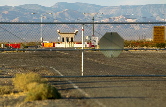 The road to Yucca Mountain is fenced off near Amagosa ...