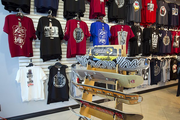 T-shirts and skateboards are shown at West Coast Street Wear at the Boulevard Mall Sunday, Sept. 6, 2015.