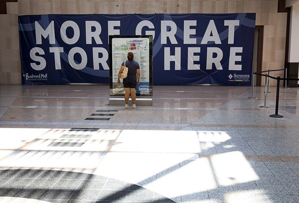 A woman looks at a store directory Sunday, Sept. 6, 2015, at the south end of Boulevard Mall. The space at the south end, formerly Dillards, is undergoing a renovation.
