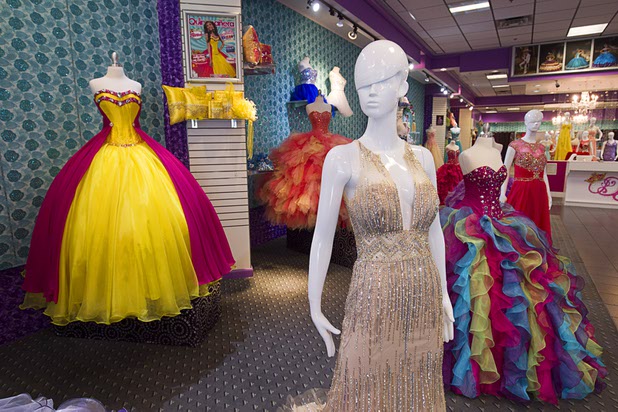 A view of dresses at the Dreams XV Boutique in the Boulevard Mall Sunday, Sept. 6, 2015.