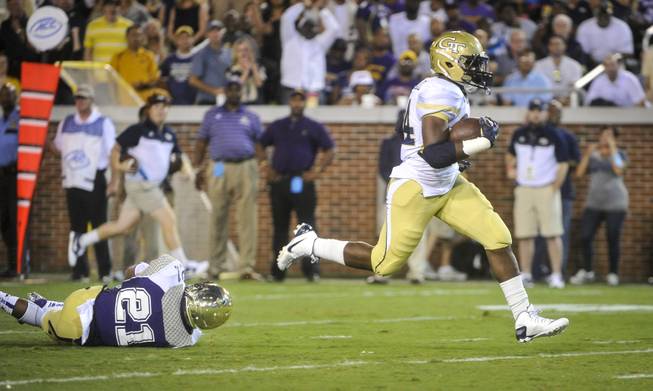 Georgia Tech running back Marcus Marshall (34) gets away from Alcorn State defensive back Quinton Cantue (21) as he runs for a touchdown during the first quarter of an NCAA college football game, Thursday, Sept. 3, 2015, in Atlanta.