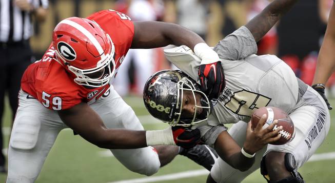 Vanderbilt quarterback Johnny McCrary (2) is sacked by Georgia linebacker Jordan Jenkins (59) for a 7-yard loss in the first half of an NCAA college football game Saturday, Sept. 12, 2015, in Nashville, Tenn.