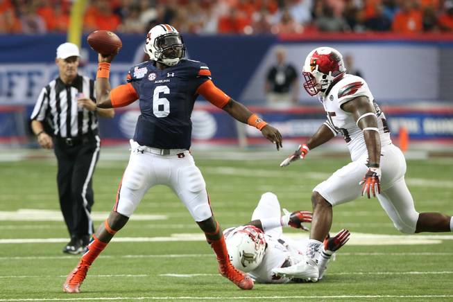 Auburn quarterback Jeremy Johnson (6) passes against Louisville during the first half of an NCAA college football game, Saturday, Sept. 5, 2015, in Atlanta.