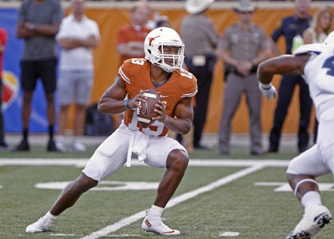 Texas quarterback Jerrod Heard looks to pass during the first half of an NCAA college football game against Rice, Saturday, Sept. 12, 2015, in Austin, Texas. 