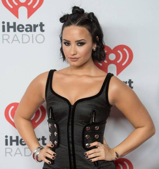 Demi Lovato arrives at the 2015 iHeartRadio Music Festival red carpet Friday, Sept. 18, 2015, at MGM Grand Garden Arena.