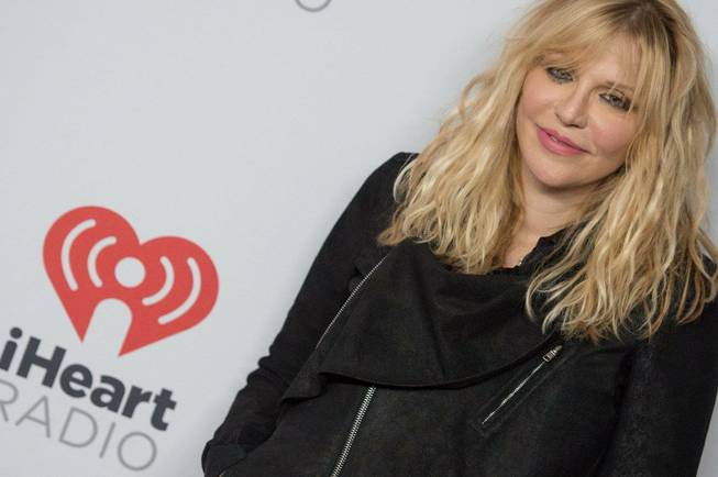 Courtney Love arrives at the 2015 iHeartRadio Music Festival red carpet Friday, Sept. 18, 2015, at MGM Grand Garden Arena.