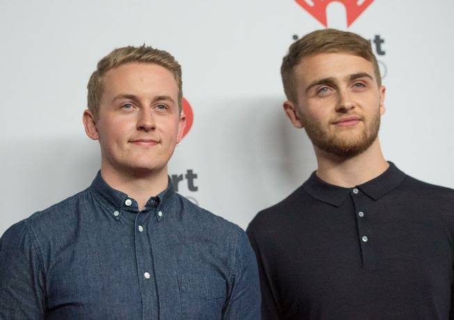 Disclosure arrives at the 2015 iHeartRadio Music Festival red carpet Friday, Sept. 18, 2015, at MGM Grand Garden Arena.