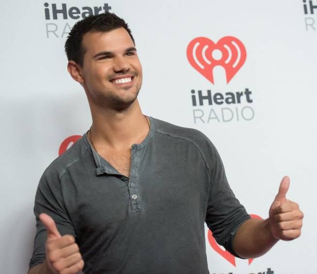 Taylor Lautner arrives at the 2015 iHeartRadio Music Festival red carpet Friday, Sept. 18, 2015, at MGM Grand Garden Arena.
