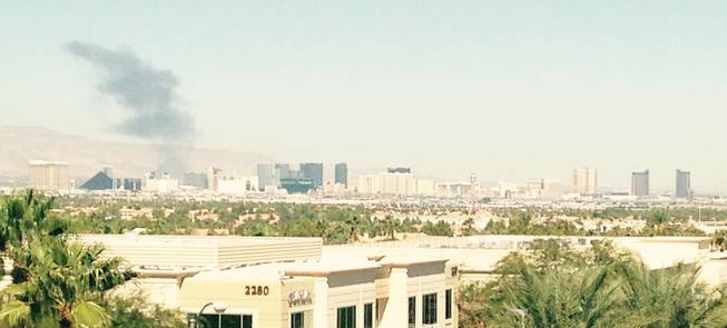 Black smoke from a fire rises over the Las Vegas strip about 10:50 a.m. today.