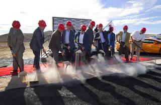 Aaron Fessler (4th right), co-founder and CEO of Speed Vegas, raises a fist during a ground breaking ceremony for Speed Vegas, a $30 million, 90-acre racetrack project on Las Vegas Boulevard south of the M Resort, Monday, Sept. 21, 2015. The project is expected to open in early 2016.