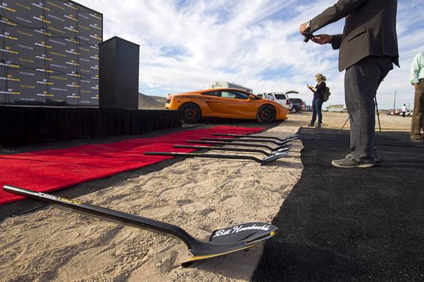 A guest takes a photo of shovels during a ground breaking ceremony for Speed Vegas, a $30 million, 90-acre racetrack project on Las Vegas Boulevard south of the M Resort, Monday, Sept. 21, 2015. The project is expected to open in early 2016.