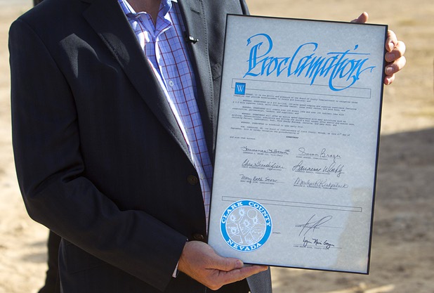 Aaron Fessler, co-founder and CEO of Speed Vegas, displays a proclamation from Clark County during a ground breaking ceremony for Speed Vegas, a $30 million, 90-acre racetrack project on Las Vegas Boulevard south of the M Resort, Monday, Sept. 21, 2015. The project is expected to open in early 2016.