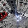 In this March 12, 2012, file photo, a Volkswagen New Beetle is lifted inside a delivery tower after the company's annual press conference in Wolfsburg, Germany. Volkswagen CEO Martin Winterkorn promised full cooperation with the government following the company's admission it rigged nearly a half million cars to defeat U.S. smog tests. 