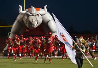 Arbor View players run out onto the field as they ready to battle Basic in high school football on Friday, September 25, 2015.