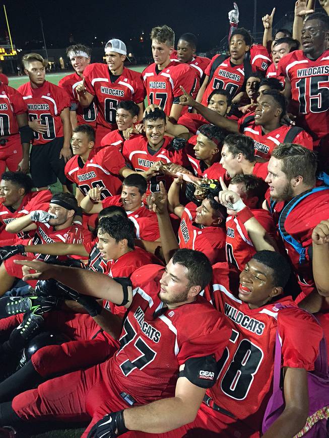 Las Vegas High football players celebrate beating Rancho in the "Bone Game," Friday, Sept. 25, 2015.
