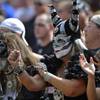 Oakland Raiders fans watch during the first half of an NFL football game against the Cleveland Browns, Sunday, Sept. 27, 2015, in Cleveland.