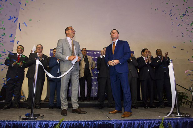 Confetti flies into the air as Herve Sedky, left, Reed Exhibitions regional president for the Americas, and Geoff Freeman, president of the American Gaming Association, cut a ribbon to open the trade show floor during the Global Gaming Expo (G2E) at the Sands Expo Center Tuesday, Sept. 29, 2015.