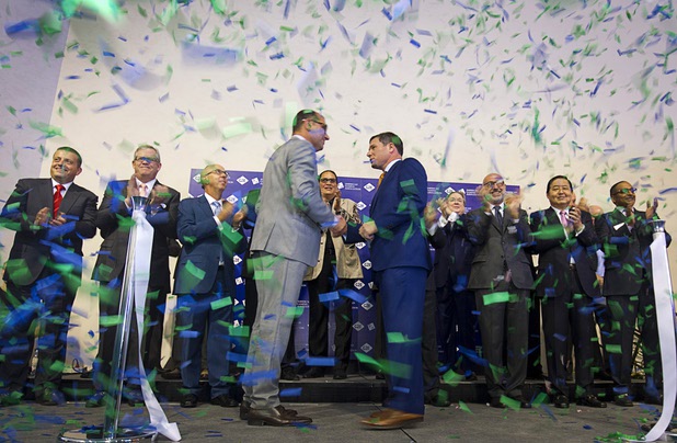 Confetti falls as Herve Sedky, left, Reed Exhibitions regional president for the Americas, and Geoff Freeman, president of the American Gaming Association, open the trade show floor with a ribbon cutting ceremony at the Global Gaming Expo (G2E) in the Sands Expo Center Tuesday, Sept. 29, 2015.