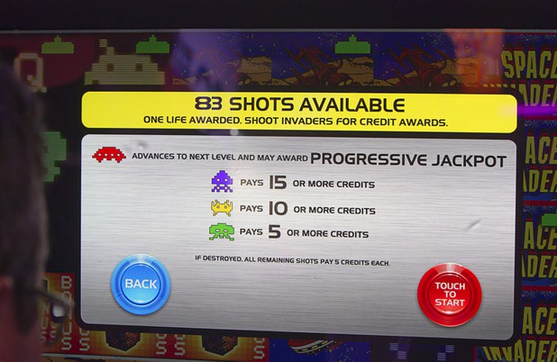 A player hits the bonus round of the Space Invaders slot machine by Scientific Games during the Global Gaming Expo (G2E) at the Sands Expo Center Tuesday, Sept. 29, 2015. The slots include a skill-based bonus round.