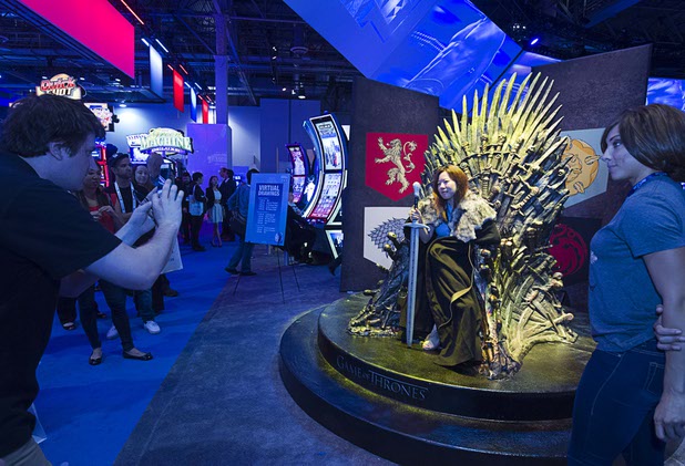 Justina Son poses at a Game of Thrones photo spot at the Aristocrat booth during the Global Gaming Expo (G2E) at the Sands Expo Center Tuesday, Sept. 29, 2015. Aristocrat