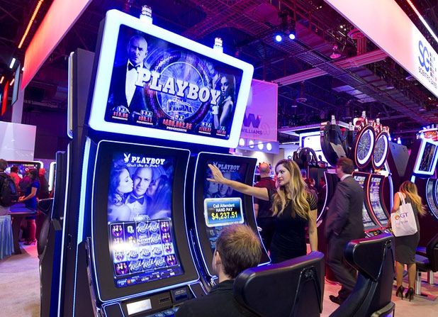 An image of Pitbull is shown on Playboy slot machines during the Global Gaming Expo (G2E) at the Sands Expo Center Tuesday, Sept. 29, 2015.