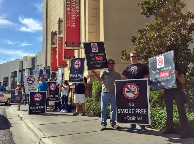 Opponents of smoking in casinos protest outside the Global Gaming Expo on Tuesday, Sept. 29, 2015, at Sands Expo and Convention Center.