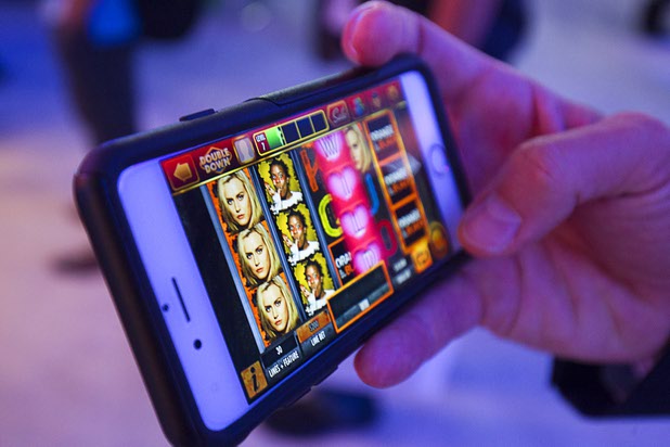 IGT's "Orange is the New Black"-themed slot game on a mobile phone during the second day of the Global Gaming Expo (G2E) in the Sands Expo Center Wednesday, Sept. 30, 2015. IGT unveiled the new game at G2E and on their Double Down online social casino at the same time, said Phil O'Shaughnessy, IGT director of global corporate communications.