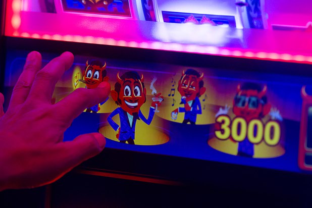 A player picks pop-up bonus icons on an IGT Spin Furno tournament slot machine during the second day of the Global Gaming Expo (G2E) in the Sands Expo Center Wednesday, Sept. 30, 2015. The Spin Furno system is the the worlds first automated tournament technology system for a spinning reel cabinet, a representative said.