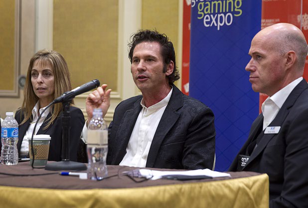 Melissa Price, left, senior vice president of gaming for Caesars Entertainment, Eric Meyerhofer, center, CEO of Gamblit Gaming, Bryan Kelly, senior vice president of technology for Scientific Games, take part in a skill-based gaming panel during the second day of the Global Gaming Expo (G2E) Wednesday, Sept. 30, 2015.