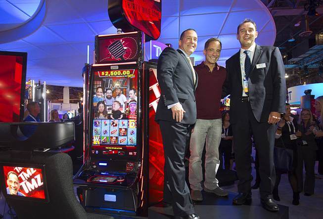 “TMZ on TV” executive producer Harvey Levin is flanked by Victor Duarte, IGT global chief product officer for gaming, and Nick Khin, IGT senior vice president of North American sales and strategic accounts, during the second day of the Global Gaming Expo on Wednesday, Sept. 30, 2015, in Sands Expo Center at the Venetian.