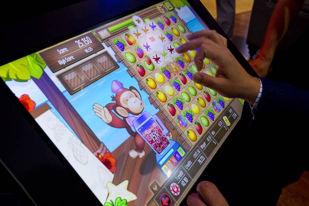 A player plays "Smoothie Blast," a skill-based game at the Gamblit booth during the second day of the Global Gaming Expo (G2E) in the Sands Expo Center on Wednesday, Sept. 30, 2015.