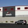 In this Wednesday, Sept. 9, 2015, photo, a car drives by a Switch data center in Las Vegas.