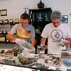 Associates Rory Turnbull and Chris Hewitt prepare bags of marijuana buds for sale at Nature Scripts medical marijuana dispensary Wednesday, Sept. 30, 2015, in Murphy, Ore. The dispensary is one of many across the state preparing for the first day of retail legal sales starting Thursday. 