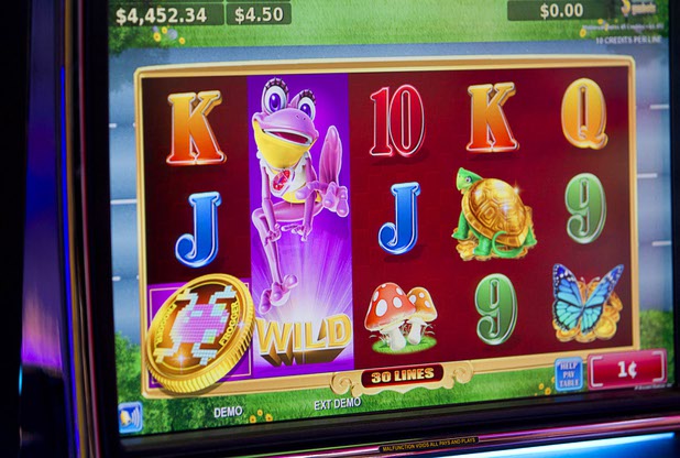 A Frogger slot machine is displayed in the Konami booth during the Global Gaming Expo (G2E) in the Sands Expo Center Thursday Oct. 1, 2015.