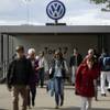 In this photo taken on Sept. 29, 2015 people leave Volkswagen factory at Gate 17 in the city Wolfsburg, Germany. Thanks to Volkswagen, Wolfsburg boomed in West Germany’s postwar rebirth and today the town and the company are inseparable. 