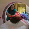 Former intern Erika Arizabal conducts a CAT Scan as an X-Ray technologist at Mountain View Hospital.
