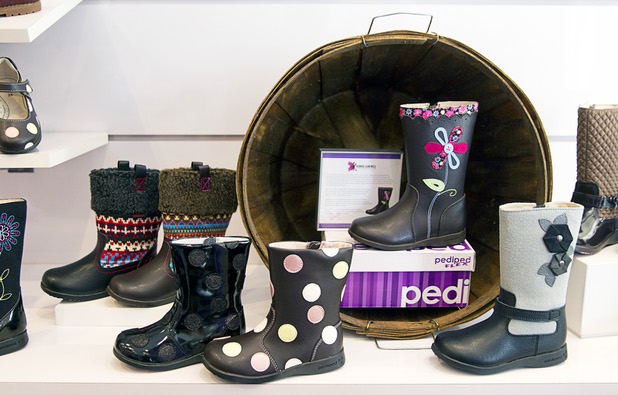 Boots are displayed in the Pediped store at Town Square Tuesday, Oct. 6, 2015.