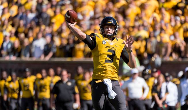 Missouri quarterback Drew Lock throws a pass during the third quarter of an NCAA college football game against South Carolina Saturday, Oct. 3, 2015, in Columbia, Mo.