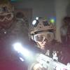 Participants in the Zombie Apocalypse Experience at Adventure Combat Ops in Las Vegas try to protect the nation from zombies. 