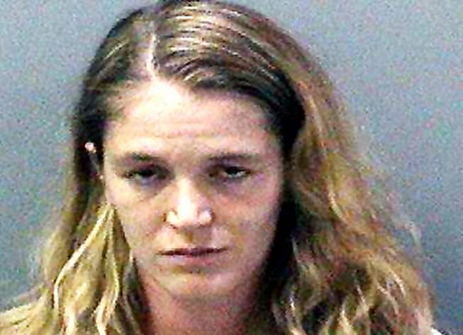 This undated booking photo shows Meghan Alt of Irvine, Calif. The California mother of three, who once won the Mrs. Orange County pageant, has been charged with using a 4-year-old relative to make child pornography. Alt was in court Friday, Oct. 9, but did not enter a plea. 