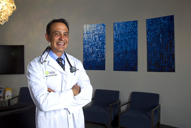 Dr. Arthur Cambeiro poses in the lobby of SurgiSpa Cosmetic and Plastic Surgery in Henderson Monday, Oct. 12, 2015. 