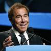 In this Thursday, Jan. 15, 2015, photo, Wynn Resorts CEO Steve Wynn delivers the keynote address at Colliers International Annual Seminar at the Boston Convention Center in Boston.