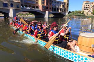 Participants attend the Rose Regatta Dragon Boat Festival at Lake Las Vegas on October 10, 2015.