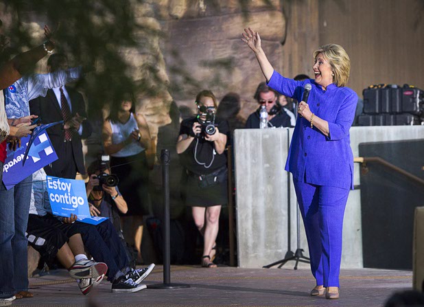 Democratic presidential candidate and former Secretary of State Hillary Rodham Clinton takes the stage during a rally at the Las Vegas Springs Preserve Wednesday, Oct. 14, 2015.