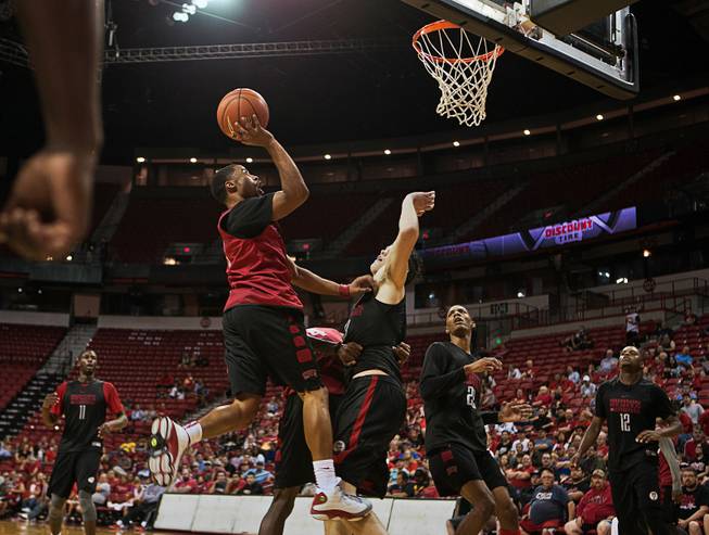 UNLV's Jerome Seagears, 2, elevates for a shot over teammate Stephen Zimmerman, 33, during their basketball team scrimmage at the Thomas & Mack Center on Thursday, October 15, 2015.