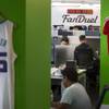 FanDuel employees are shown in the fantasy sports company's offices Thursday, Sept. 24, 2015, in New York.