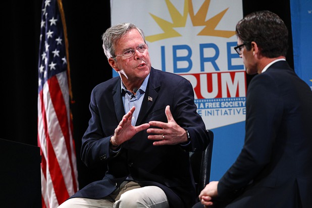 Republican presidential candidate Jeb Bush speaks with Daniel Garza, executive director of the Libre Initiative, during the Libre Initiative's policy forum series, "The Libre Forum: Unlimited Opportunities in a Free Society," at the College of Southern Nevada on Wednesday, Oct. 21, 2015, in North Las Vegas.