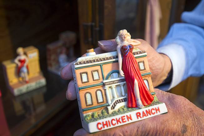 Lonnie Hammargren holds a Chicken Ranch whiskey bottle at his home Thursday, Oct. 22, 2015. Hammargren, a retired neurosurgeon and former Nevada Lt. Governor, opens his home to the public on Nevada Day.