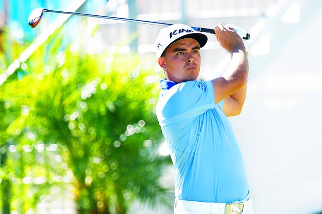 Rickie Fowler tees off during the third round of the Shriners Hospitals for Children Open PGA tournament at TPC Summerlin Saturday, Oct. 24, 2015, in Las Vegas.