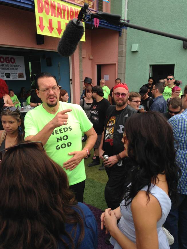 Penn Jillette is corralled by a film crew following the cast of MTV’s “The Real World Las Vegas” during the United Church of Bacon fundraiser Sunday, Oct. 25, 2015, at the Slammer.